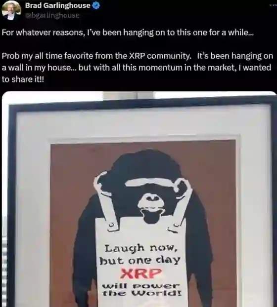 Brad Garlinghouse's tweet: a framed print of the Laugh Now stencil hanging in his house, captioned as his all-time favorite from the XRP community